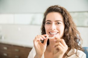 Can I brush my teeth while using Invisalign? | Smile Dental and Implant Centre