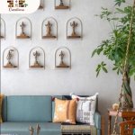 Traditional Wall Decor with Brass Idols and Elegant Seating